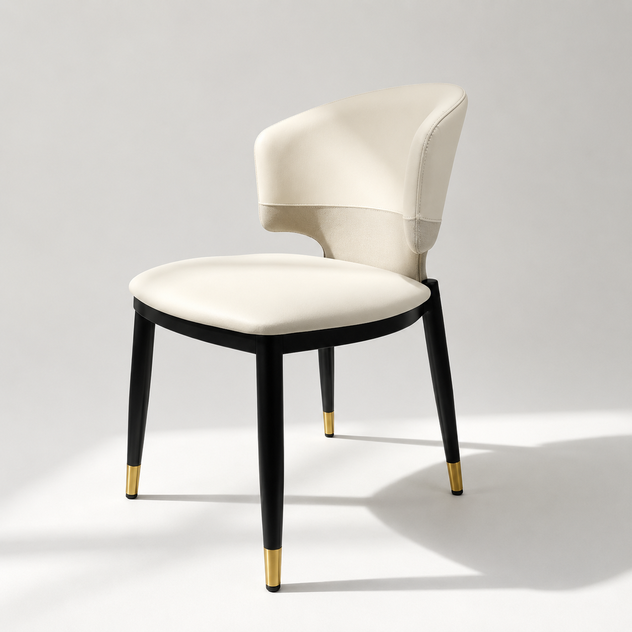 Contemporary Black Upholstered Barrel Dining Chair with Gold-Capped Legs