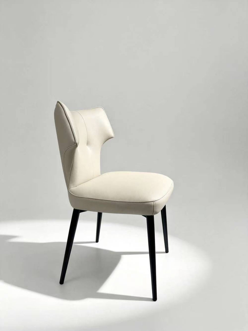 Contemporary Tufted Upholstered Dining Chair with Wingback Design & Gold-Capped Legs