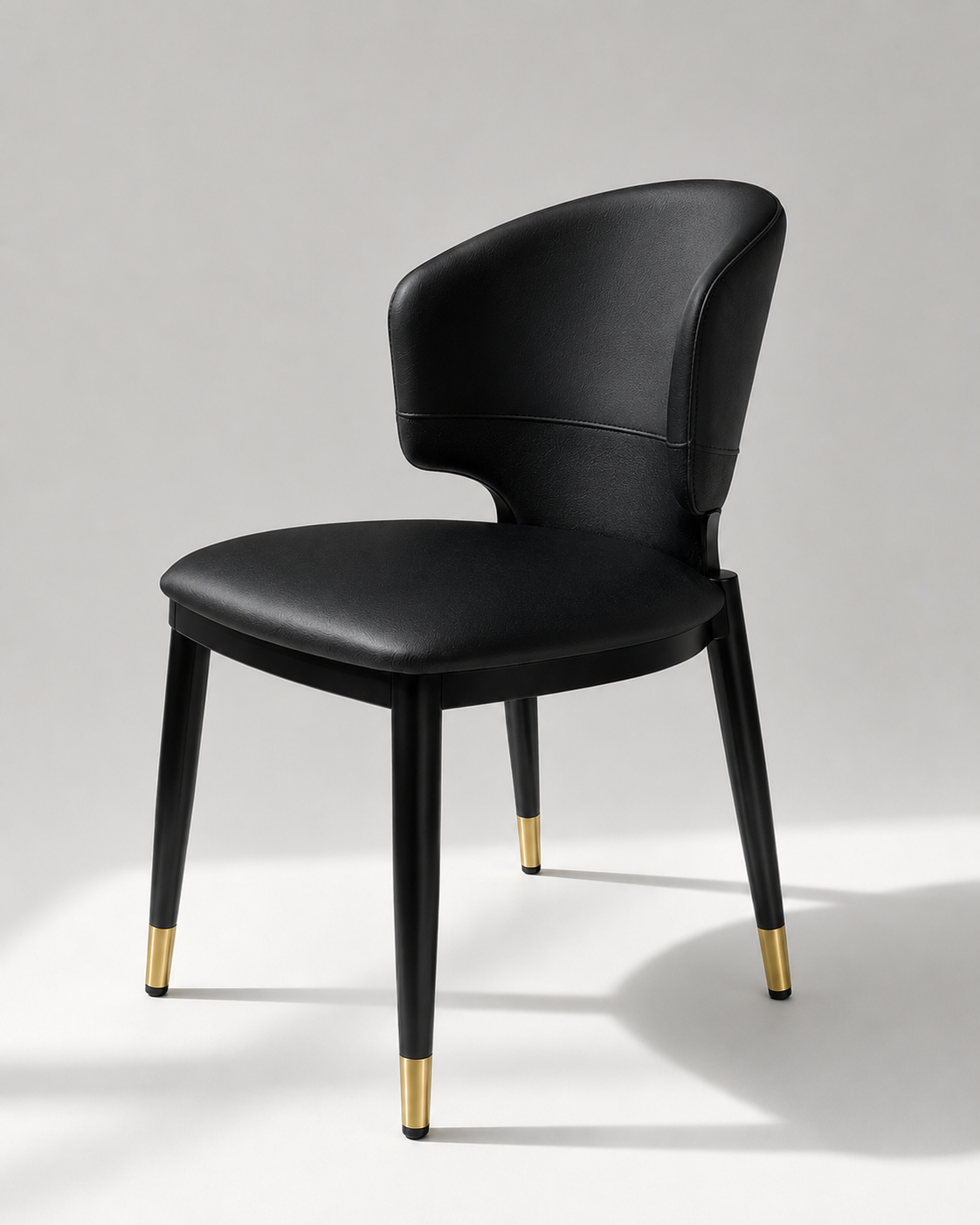 Contemporary Black Upholstered Barrel Dining Chair with Gold-Capped Legs