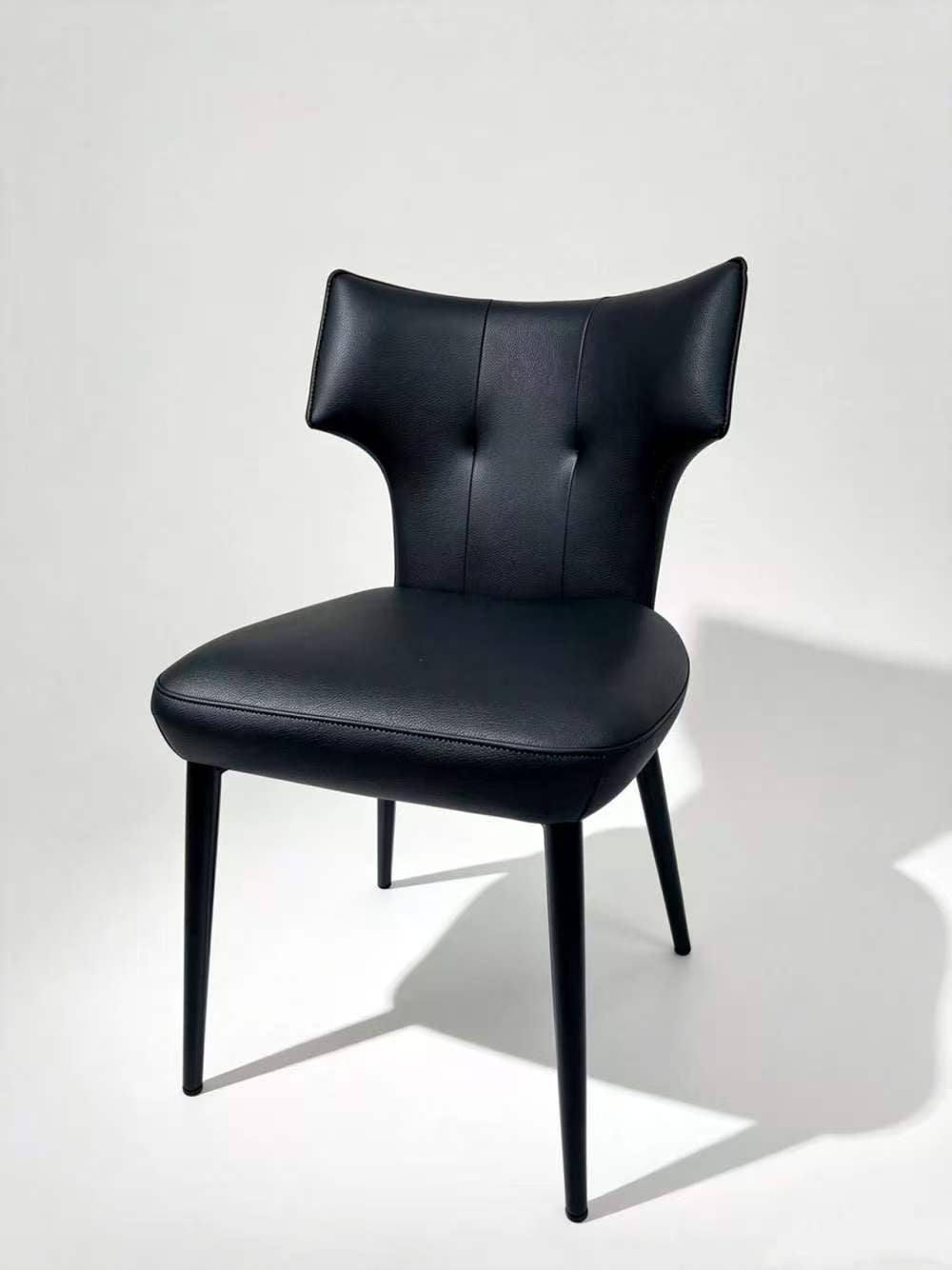 Contemporary Tufted Upholstered Dining Chair with Wingback Design & Gold-Capped Legs