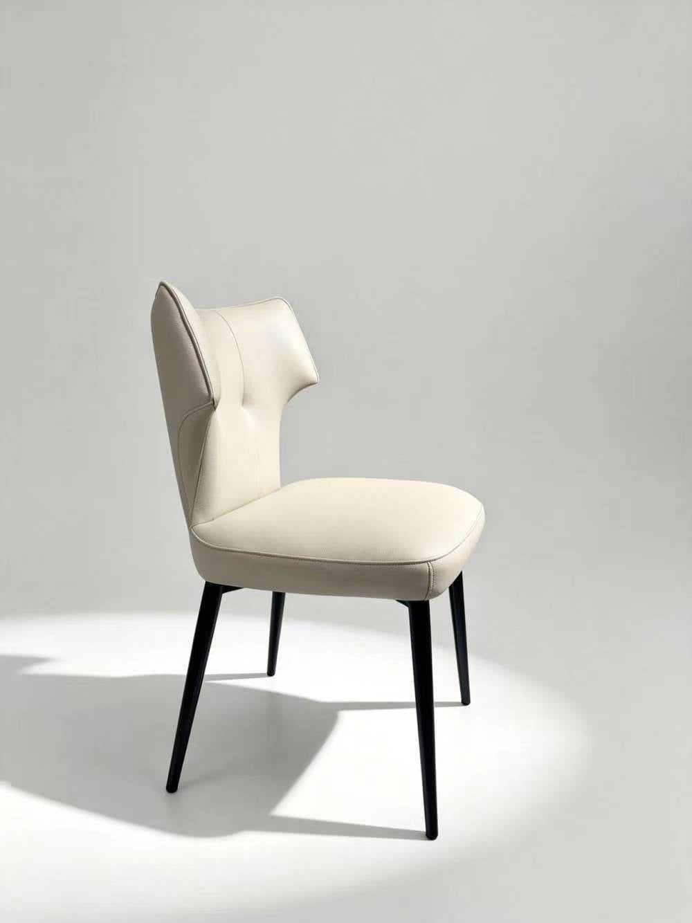 Contemporary Tufted Upholstered Dining Chair with Wingback Design & Gold-Capped Legs