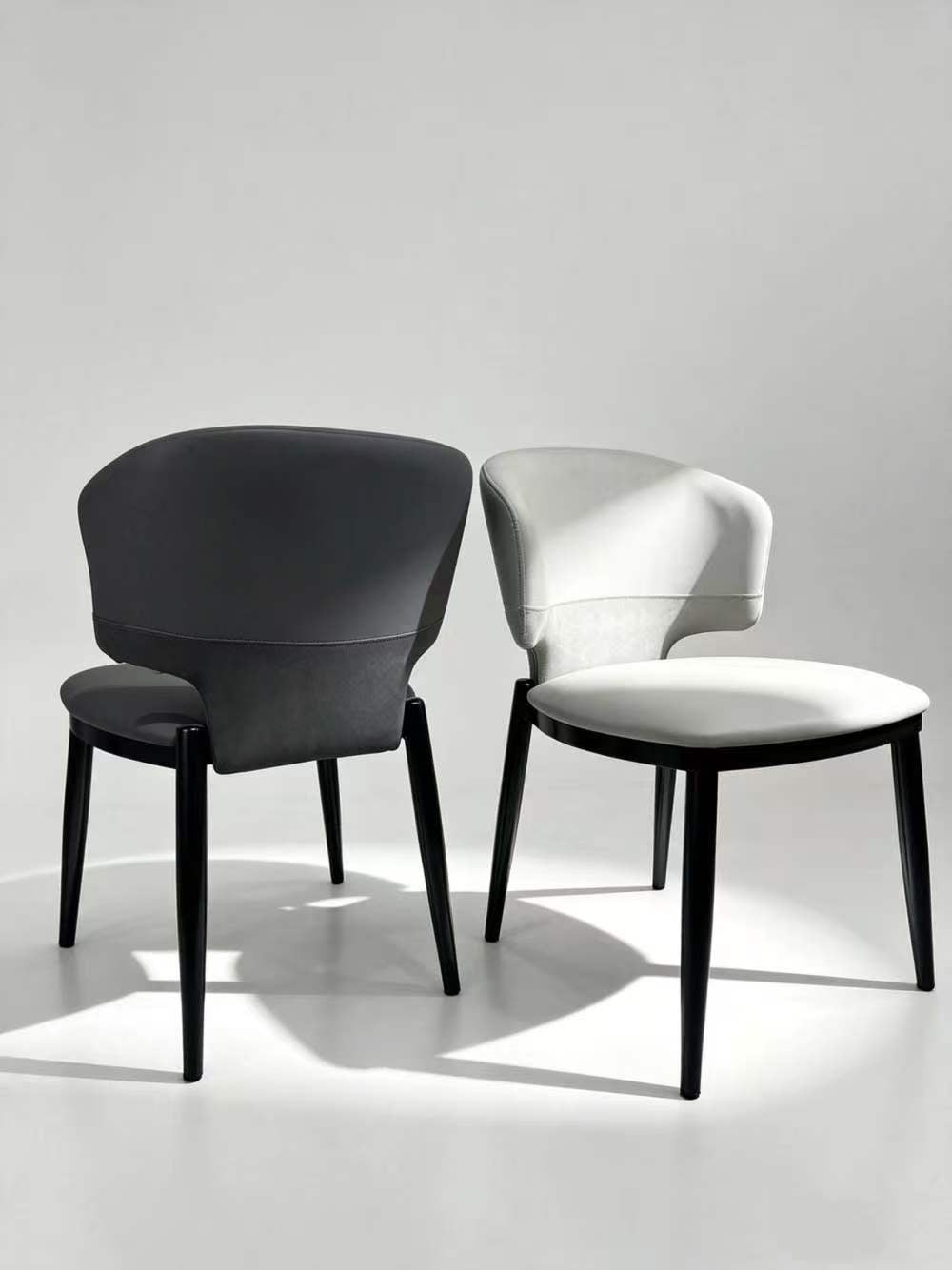Contemporary Black Upholstered Barrel Dining Chair with Gold-Capped Legs